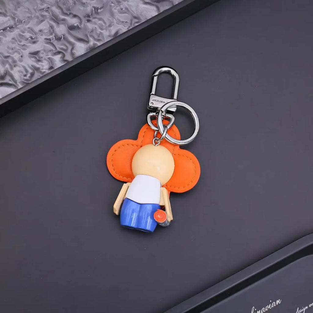 Rear view of orange Vivienne keychain and silver-tone clasp