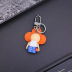 Rear view of orange Vivienne keychain and silver-tone clasp