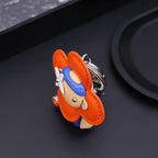 Side view of orange flower-shaped Vivienne keychain