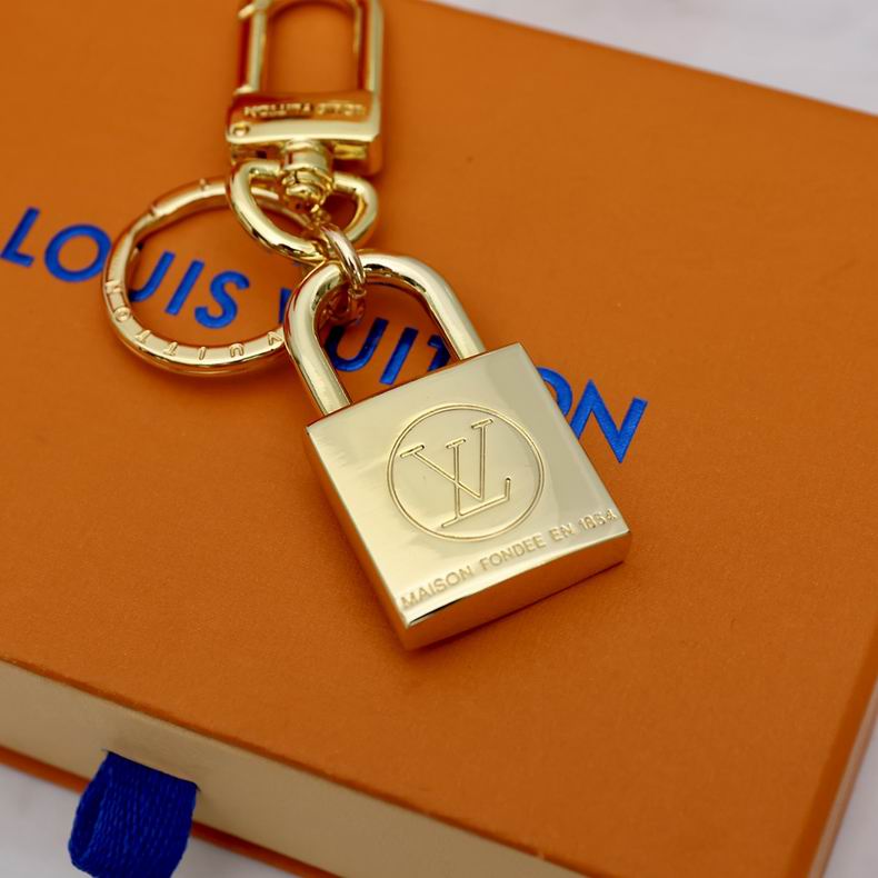 Gold-tone padlock keychain with round LV emblem