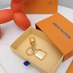 Padlock keychain arranged inside an open orange box