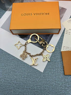 Flower and LV charm keychain curved into a loop
