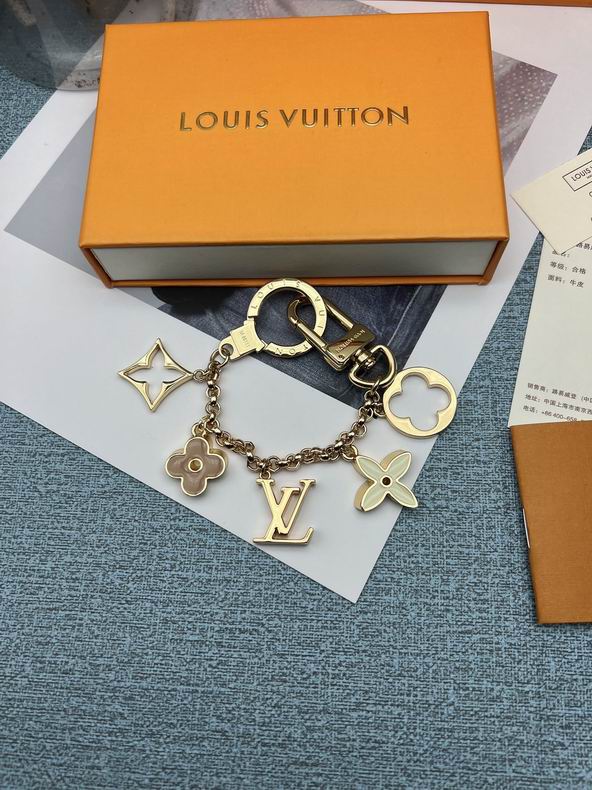 Flower and LV charm keychain curved into a loop
