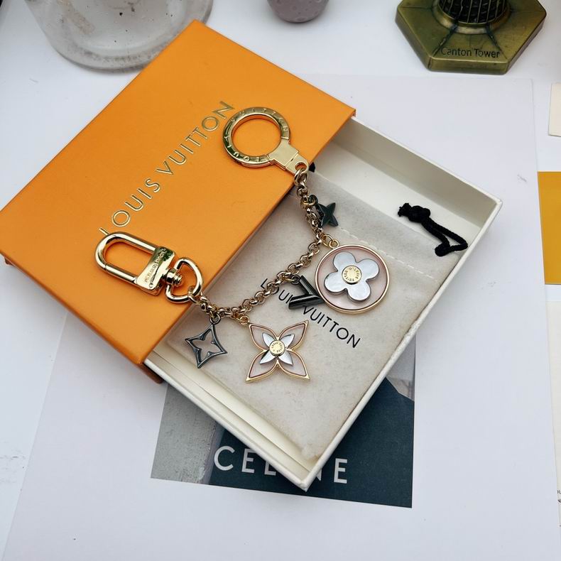 Chain keychain with pale flowers and dark monogram ornaments
