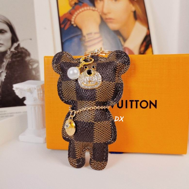 Brown checkered bear keychain with jeweled muzzle and gold-tone ring