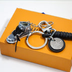 Close-up of black sneaker charm and silver-tone keyring