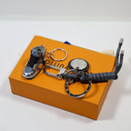 Top view of black sneaker keychain and looped cord