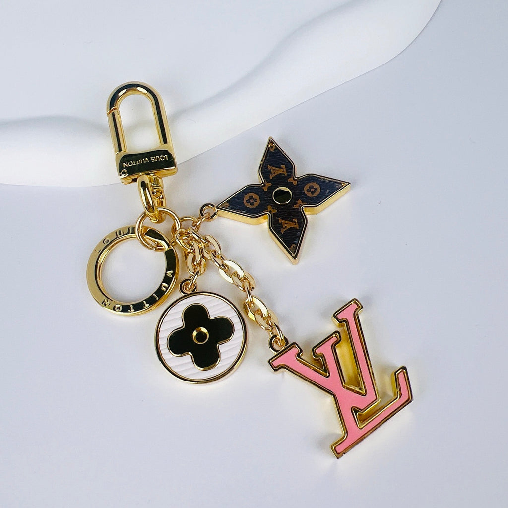 Pink LV charm with dark monogram flower and white medallion