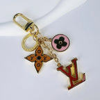 Red LV charm with brown monogram flower and pink medallion